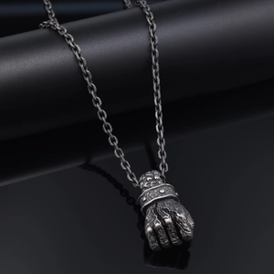 Vintage stainless steel fist pendant necklace with oxidized punk style and O-ring chain