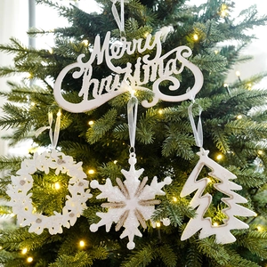 White Christmas ornaments with gold glitter featuring Merry Christmas sign and snowflakes