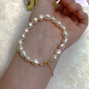 Wrist close-up of Baroque freshwater pearl bracelet with 14K gold plated spring clasp