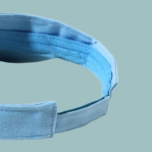 Detailed macro view of the inner sweatband and adjustable velcro strap on the blue sun visor