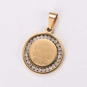 Macro view of 18k gold plated round pendant with crystals and Arabic calligraphy