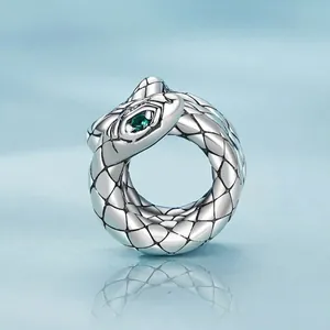 Retro S925 sterling silver coiled snake charm with green gemstone eyes and scale details