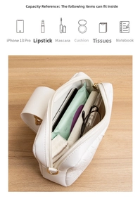 Macro view of white embossed crossbody bag interior showing spacious storage for essentials