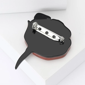 Detail view of the silver metal pin attachment on the back of enamel rose brooches