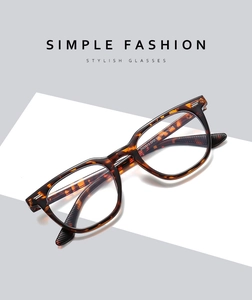 Detailed close-up of tortoise shell square glasses frame with polished finish and metal studs