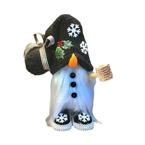 Plush Christmas gnome doll with black snowflake hat and orange nose for holiday decor