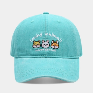 Detailed embroidery of lucky animals on a washed mint green cotton baseball cap