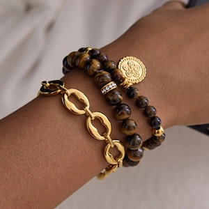 Three-piece titanium steel bracelet set featuring gold chain and tiger eye stone beads