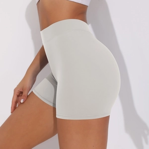 Close-up of high-waisted seamless scrunch yoga shorts in light gray with ruched detail