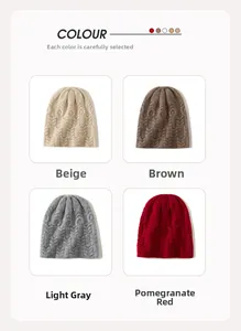 Macro detail of various color options for the cable knit cashmere beanie for winter