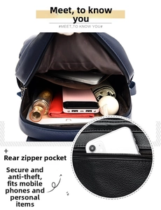 Detail of blue leather backpack showing large main pocket and rear anti-theft zipper pocket