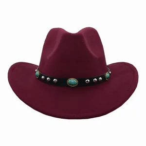 Close-up of burgundy felt cowboy hat with turquoise embellishments and metal studs