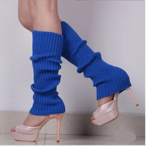 Close-up of royal blue cable knit leg warmers with thick ribbed texture for winter fashion