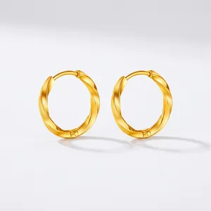 Detail view of twisted gold hoop earrings with 2.5mm line width and 12mm inner diameter