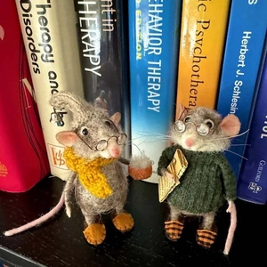 Handmade needle felted mouse figurines with yellow knitted scarf and green sweater