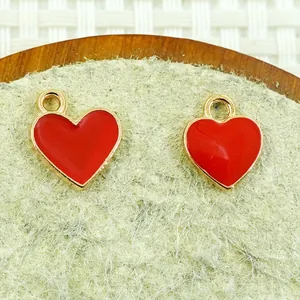 Pair of red heart enamel alloy charms with gold metallic edges for DIY jewelry making