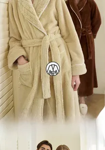 Detail showing the wheat grain texture on long coral fleece bathrobe with shawl collar