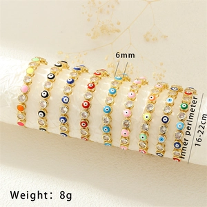 Detail showing various candy-colored evil eye enamel bracelets with inlaid zircon stones