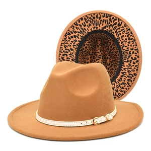 Detail of wool fedora hat with white buckled belt and leopard print lining under the brim