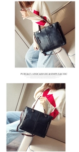 Classic black vintage oil leather tote bag with functional pockets and long shoulder strap