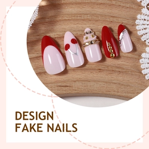 Luxurious almond-shaped handmade fake nails with red cherry designs and 3D gold accents