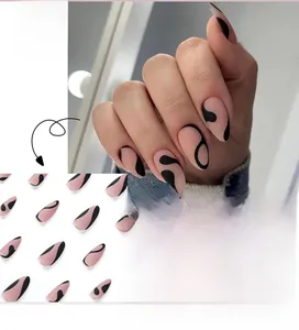 Pink almond press-on nails with black abstract French curves displayed on hand and in set