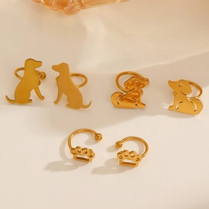Detail of 6-piece gold hollow dog and paw print ear clips for non-pierced ears