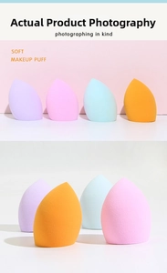 Close-up of four colorful teardrop makeup sponges with angled cuts for precise makeup application