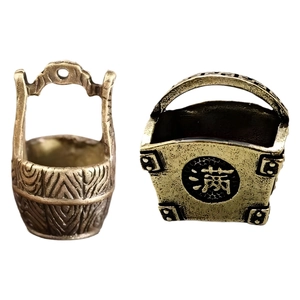 Miniature brass prosperity buckets with vintage texture and auspicious characters