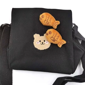 Black canvas crossbody bag with cute bear embroidery and brown taiyaki plush charms