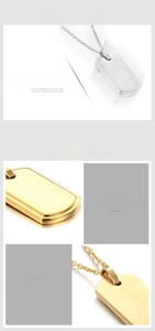 Detailed view of polished shield-shaped 316L stainless steel pendants in gold and silver