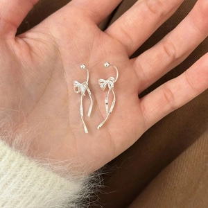Elegant silver bow ribbon drop earrings with metallic finish for women's fashion