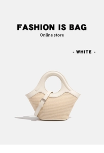 Detail of woven straw handbag with white leather trim and round handle in minimal style