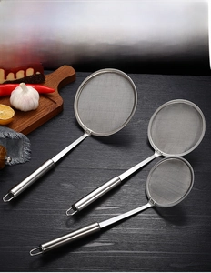 Three-piece set of fine mesh stainless steel oil skimmers in various sizes on wooden surface