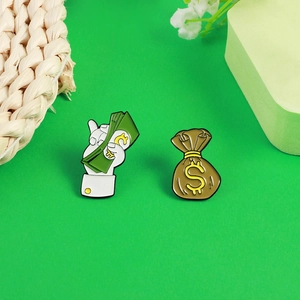 Cartoon money bag and dollar hand enamel pin set on a bright green fashion background