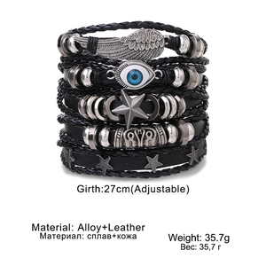 Vintage multi-layer leather bracelet for men featuring metal wings and evil eye charms
