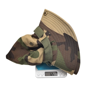 Lightweight woodland camouflage boonie hat shown on a digital scale weighing 122.8g
