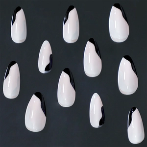 French tip press-on nails with minimalist black and white abstract swirl almond shape