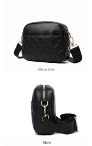 Detail view of black quilted crossbody bag with gold zippers and wide woven strap