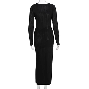 Detail of black long sleeve dress featuring vertical ribbed texture and slim fit design