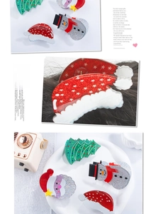 Detail of Christmas Santa and tree hair claws with festive glitter acrylic finish