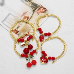 Beaded strawberry and cherry charm bracelet set with 18k gold plating and adjustable cords