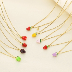Colorful strawberry pendant necklaces in various dopamine shades on gold steel chains