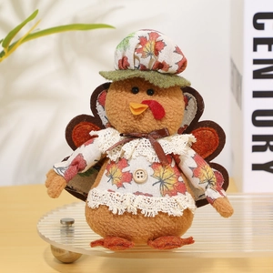 Detailed view of plush Thanksgiving turkey doll with lace decor and maple leaf pattern