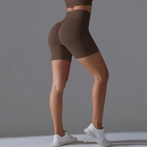 Detail of high-waist ribbed yoga shorts in coffee brown featuring seamless push-up design