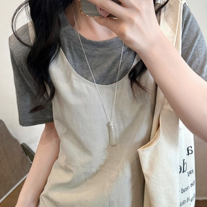 Chic silver necklace with textured cuboid pendant worn over casual outfit for daily wear