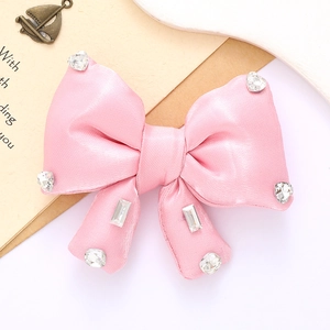 Pink satin bow accessory with sparkling rhinestone crystals for clothing and bags