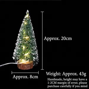 Mini lighted Christmas tree with snow-dusted needles and a natural wooden base, 20cm height