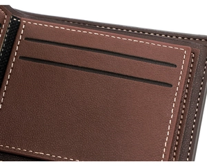 Detailed close-up showing layered card slots and precision white stitching on brown leather