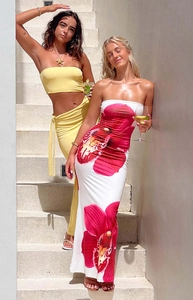 Detail of yellow tube top set and pink floral print bodycon maxi dress for summer vacation